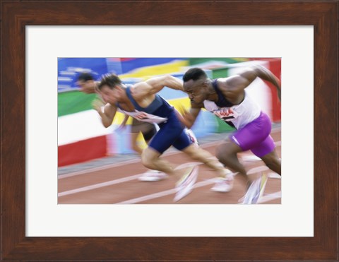 Framed Side profile of three men running low on a running track Print