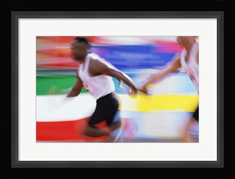 Framed Side profile of two young men passing a relay baton Print