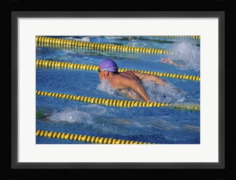 Framed Swimmer racing in a swimming pool Print