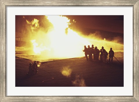 Framed High angle view of firefighters extinguishing a fire Print