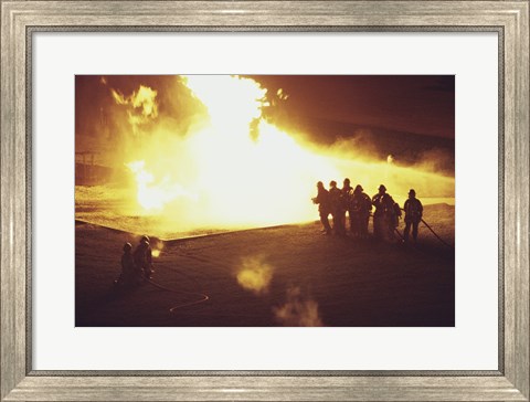 Framed High angle view of firefighters extinguishing a fire Print