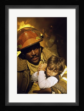 Framed Firefighter carrying a boy Print