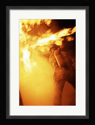 Framed Fireman fighting with fire flames Print
