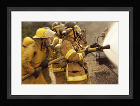 Framed Side profile of a group of firefighters holding water hoses Print