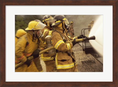 Framed Side profile of a group of firefighters holding water hoses Print