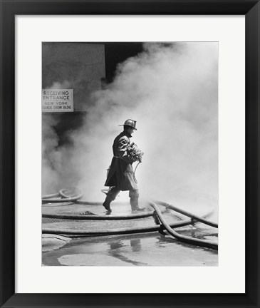Framed Firefighter walking in front of smoke Print