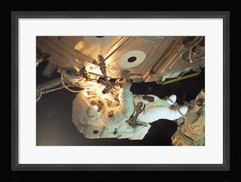 Framed Astronaut Sellers Working on ISS Print
