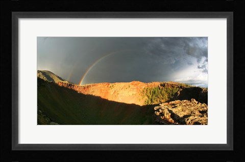 Framed Crater of an extinct volcano with a rainbow in the sky Print