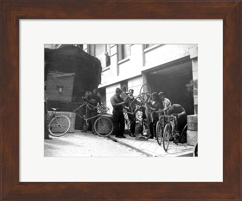 Framed Taking care of  maintenance of the racing bicycles during a rest day in Belfort Print