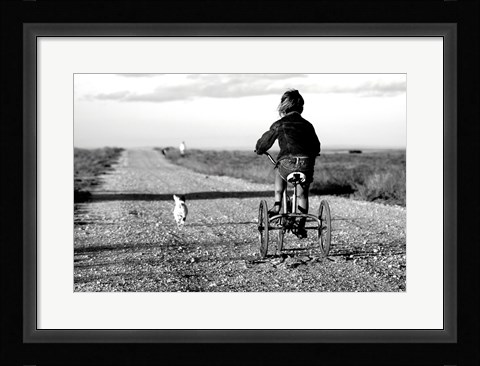 Framed Rear view of a girl riding a bicycle Print