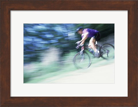Framed Side profile of a young man riding a bicycle Print