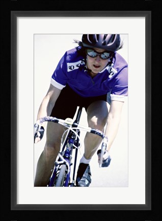 Framed Young woman riding a bicycle Print