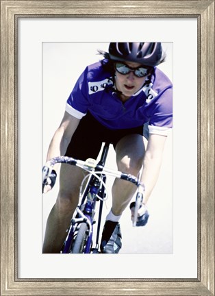 Framed Young woman riding a bicycle Print