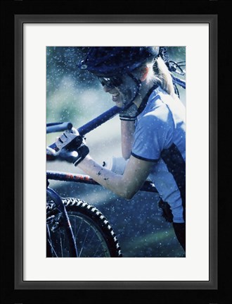 Framed Young woman carrying a bicycle on her shoulders Print