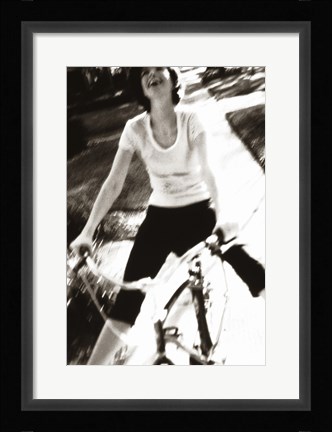 Framed Young woman riding a bicycle - black &amp; white Print
