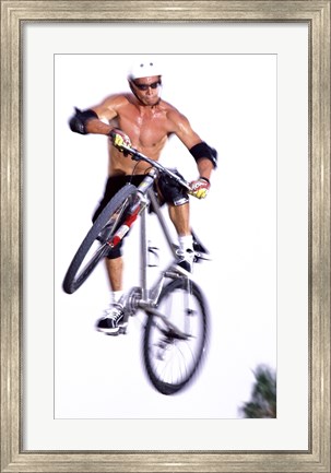 Framed Young man on a bicycle in mid-air Print