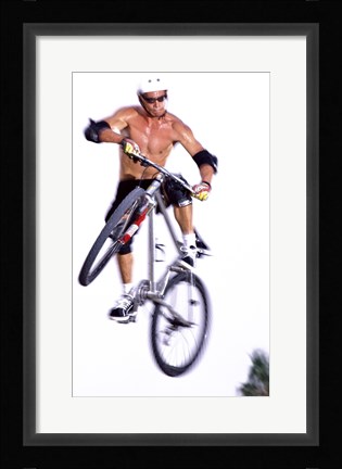Framed Young man on a bicycle in mid-air Print