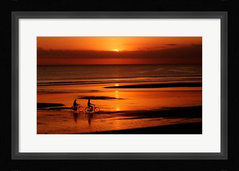 Framed Silhouette of a young couple cycling on the beach Print