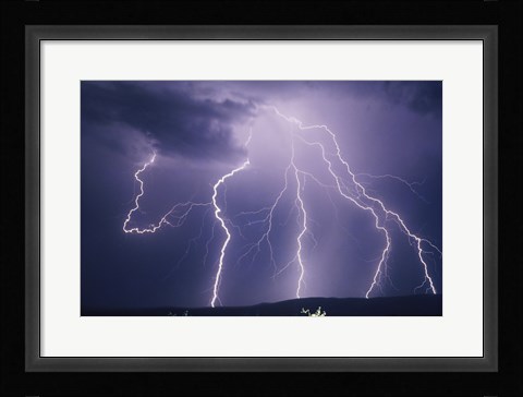 Framed Lightning bolts striking the earth Print