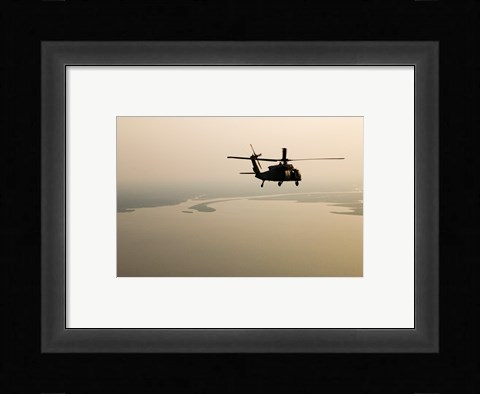 Framed Air Force helicopter flys over Lake Pontchatrain to New Orleans Print