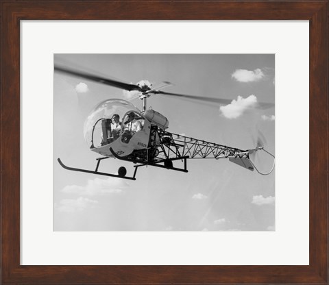 Framed Low angle view of two people sitting in a helicopter, Bell 47G-2 Print
