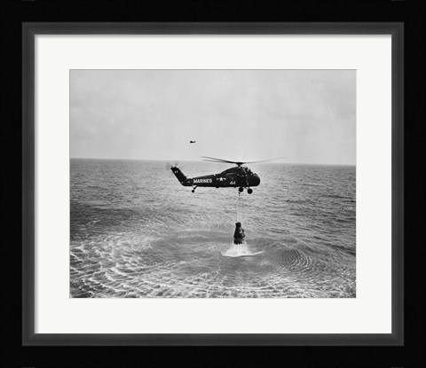 Framed Marine helicopter lifting the astronaut spacecraft out of the Ocean Print