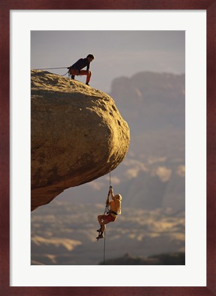 Framed View of rock climbers on the edge of a cliff Print