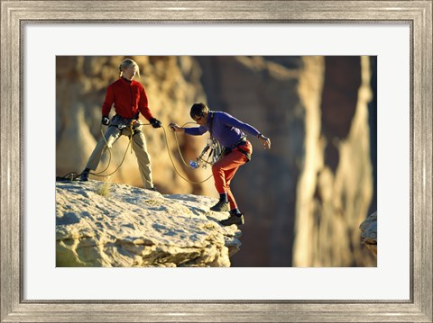 Framed Two hikers with ropes at the edge of a cliff Print