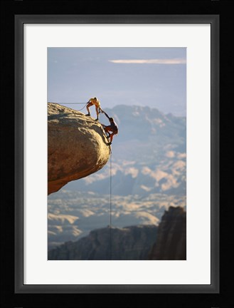 Framed Two hikers with ropes at the edge of a cliff 2 Print