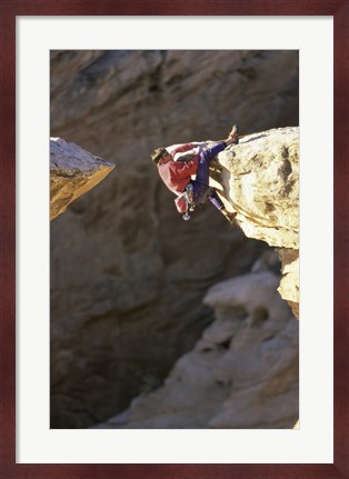 Framed High Angle View of a Man hanging off of a Summit Print