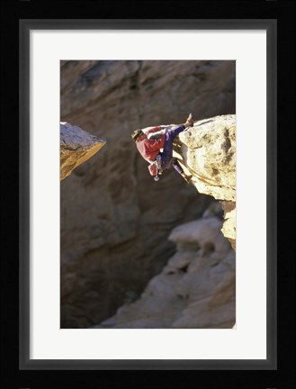 Framed High Angle View of a Man hanging off of a Summit Print