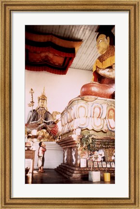 Framed Young Girl Praying in Front of a Giant Buddha Statue Print