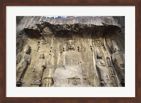 Framed Buddha Statue Carved on a wall, Longmen Caves,  ground view in China Print