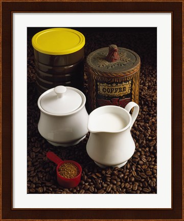 Framed Close-up of a mug of milk with a measuring spoon and jars on coffee beans Print
