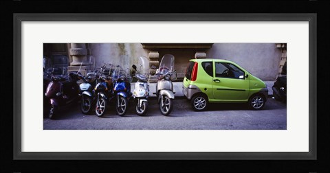 Framed Motor scooters with a car parked in a street, Florence, Italy Print