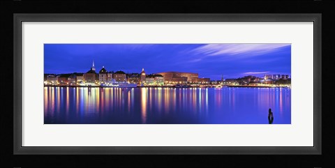 Framed Buildings at the waterfront lit up at dusk, Stockholm, Sweden Print
