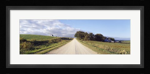 Framed Dirt road leading to a church, Iowa, USA Print