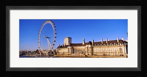 Framed Ferris wheel with buildings at the waterfront, River Thames, Millennium Wheel, London County Hall, London, England Print