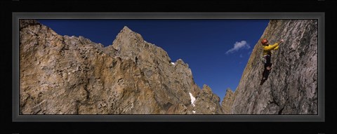 Framed Man climbing up a mountain, Grand Teton, Grand Teton National Park, Wyoming, USA Print