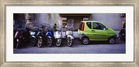 Framed Motor scooters with a car parked in a street, Florence, Italy Print