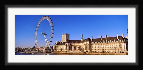 Framed Ferris wheel with buildings at the waterfront, River Thames, Millennium Wheel, London County Hall, London, England Print