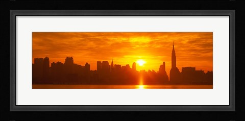 Framed Birght Orange Sky and Sun Behind the New York City Skyline Print