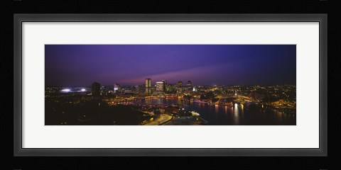 Framed Aerial view of a city lit up at dusk, Baltimore, Maryland, USA Print