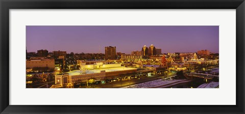 Framed High angle view of buildings lit up at dusk, Kansas City, Missouri, USA Print