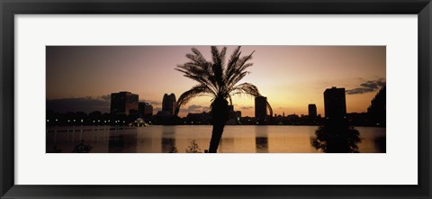 Framed Silhouette of buildings at the waterfront, Lake Eola, Summerlin Park, Orlando, Orange County, Florida, USA Print