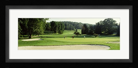 Framed Four people playing on a golf course, Baltimore County, Maryland, USA Print