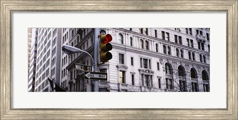 Framed Low angle view of a Red traffic light in front of a building, Wall Street, New York City Print