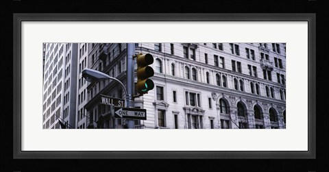 Framed Low angle view of a Green traffic light in front of a building, Wall Street, New York City Print