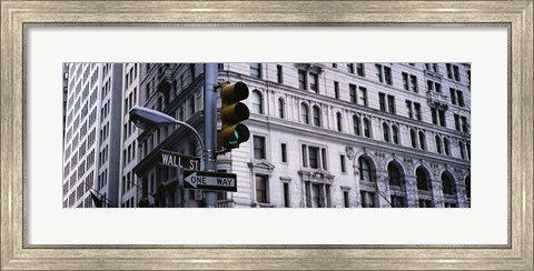 Framed Low angle view of a Green traffic light in front of a building, Wall Street, New York City Print