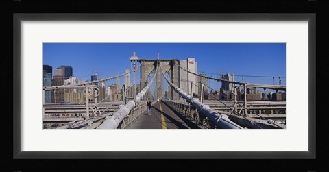 Framed Rear view of a woman walking on a bridge, Brooklyn Bridge, Manhattan, New York City, New York State, USA Print